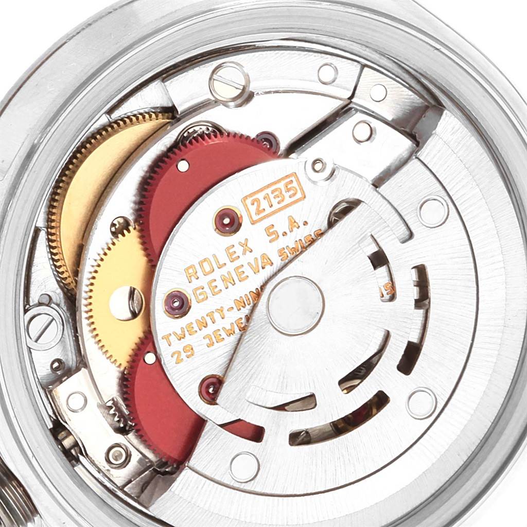 The image shows a close-up view of the inner mechanical movement of a Rolex Datejust 69174 Women
s Stainless Steel Pink Dial 69174 Women
s Stainless Steel Pink Dial watch.