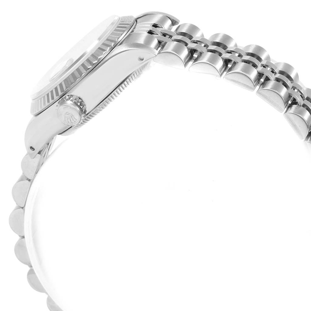 The image shows a side view of the Rolex Datejust 69174 Women
s Stainless Steel Pink Dial 69174 Women
s Stainless Steel Pink Dial, highlighting the crown, bezel, and part of the bracelet.