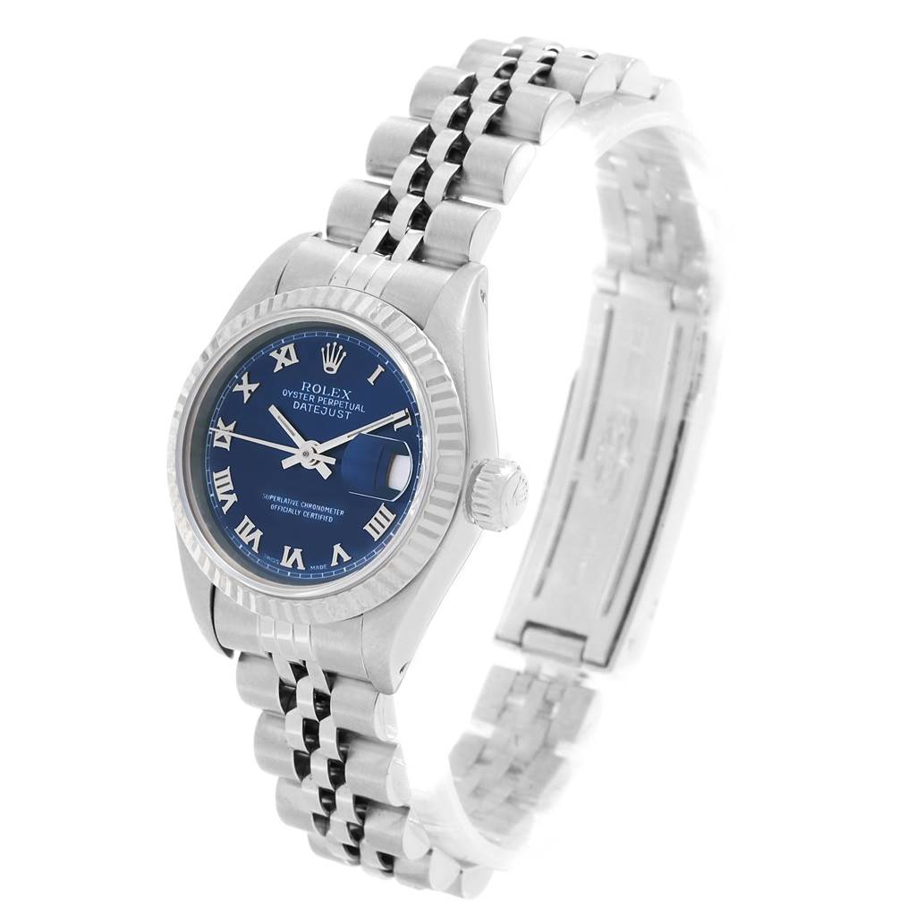 The Rolex Datejust 69174 Women
s Stainless Steel Blue Dial 69174 Women
s Stainless Steel Blue Dial watch is shown at a slight angle, highlighting the blue dial, bezel, crown, and Jubilee bracelet.