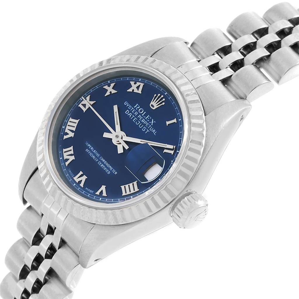 The Rolex Datejust 69174 Women
s Stainless Steel Blue Dial 69174 Women
s Stainless Steel Blue Dial watch is shown at a slight angle, highlighting the blue dial, bezel, crown, and part of the bracelet.