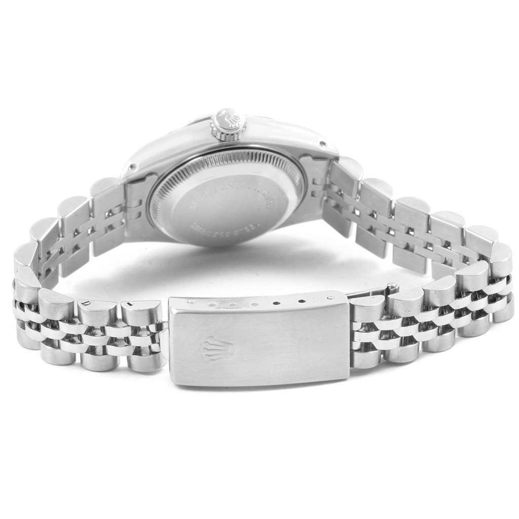 The image shows the backside of a Rolex Datejust 69174 Women
s Stainless Steel Blue Dial 69174 Women
s Stainless Steel Blue Dial watch, focusing on the case back and Jubilee bracelet.