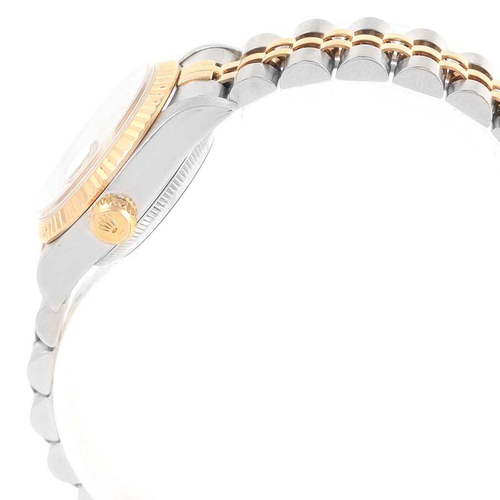 The image shows a side view of the Rolex 69173 Men's Stainless Steel Champagne Dial 69173 Men's Stainless Steel Champagne Dial Datejust 26mm Steel 18K Yellow Gold Ladies Watch 69173, focusing on the bezel, crown, and part of the bracelet.