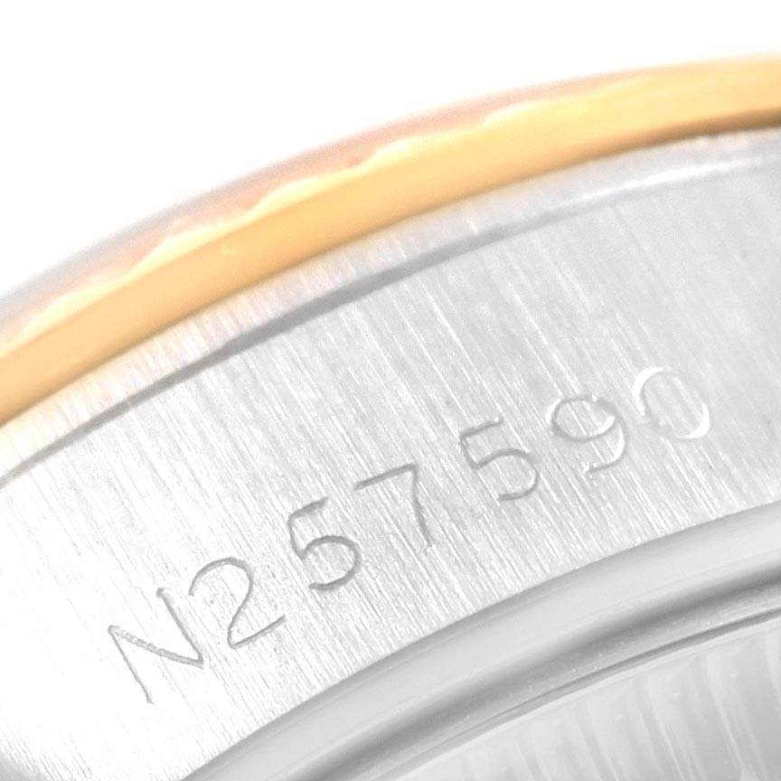 The image shows a close-up of the serial number on the side of the Rolex 69173 Men's Stainless Steel Champagne Dial 69173 Men's Stainless Steel Champagne Dial Datejust 26mm Steel 18K Yellow Gold Ladies Watch 69173 Papers.