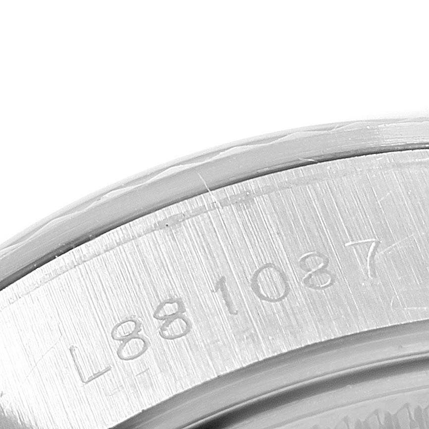 This image shows a close-up angle of the serial number engraved on the case back of a Rolex Datejust 69174 Women's Stainless Steel Silver Dial 69174 Women's Stainless Steel Silver Dial watch.