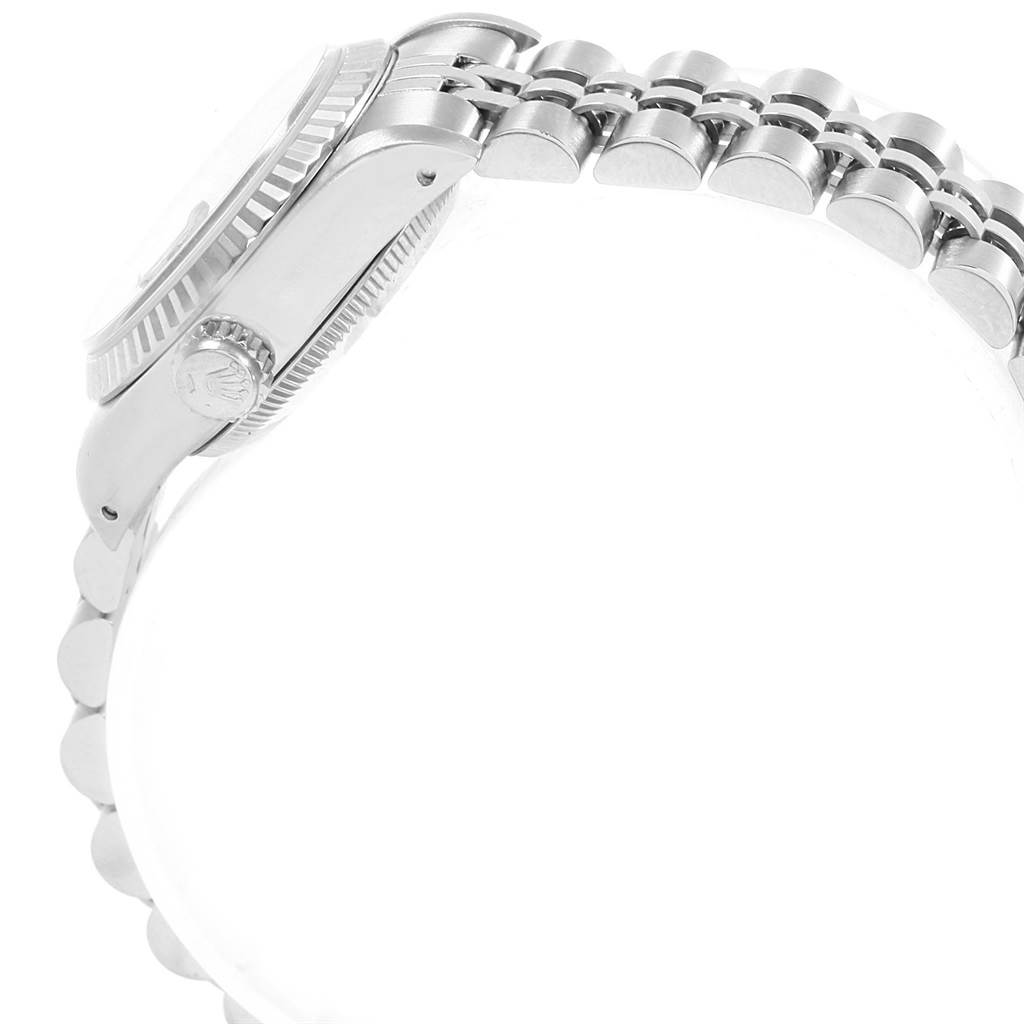 The image shows a side view of a Rolex Datejust 69174 Women's Stainless Steel Silver Dial 69174 Women's Stainless Steel Silver Dial watch, highlighting the crown, bezel, and a portion of the bracelet.