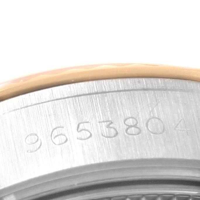 This image shows a close-up view of the serial number engraved on the side of a Rolex Datejust 69173 Women's Stainless Steel Champagne Dial 69173 Women's Stainless Steel Champagne Dial watch case.
