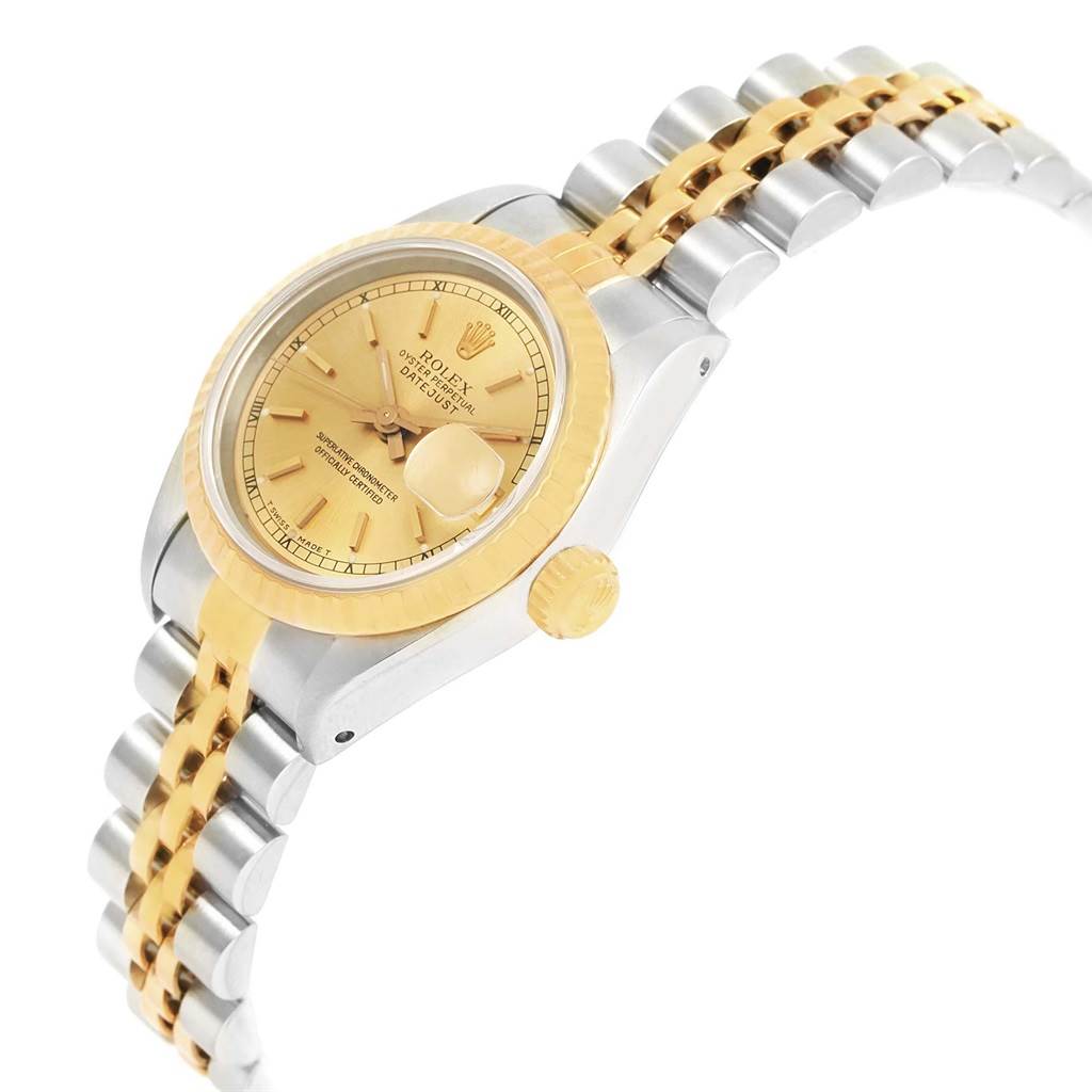 This image shows a Rolex Datejust 69173 Women's Stainless Steel Champagne Dial 69173 Women's Stainless Steel Champagne Dial watch at an angled side view, highlighting the gold bezel, champagne dial, crown, and two-tone bracelet.