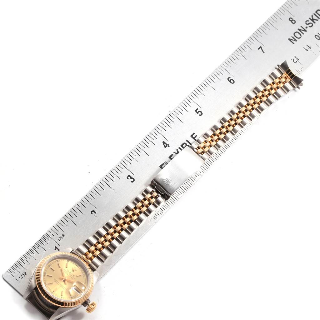 The image shows a Rolex Datejust 69173 Women's Stainless Steel Champagne Dial 69173 Women's Stainless Steel Champagne Dial watch laid flat with its bracelet alongside a ruler for measurement.