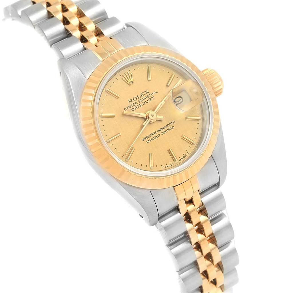 This image shows a Rolex Datejust 69173 Women
s Stainless Steel Champagne Dial 69173 Women
s Stainless Steel Champagne Dial watch at a tilted angle, displaying the face, bezel, case, and bracelet.