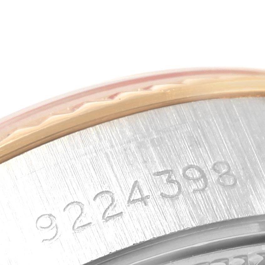 The image shows a close-up of the serial number engraved on the side of the bezel and case of a Rolex Datejust 69173 Women
s Stainless Steel Champagne Dial 69173 Women
s Stainless Steel Champagne Dial watch.