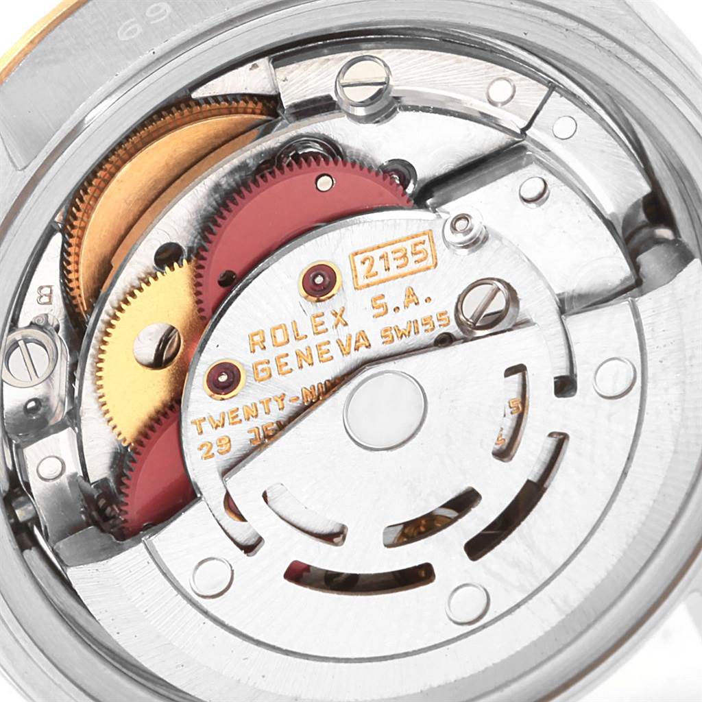 This image shows the internal mechanism and movement, specifically the caliber 2135, of a Rolex Datejust 69173 Women
s Stainless Steel Champagne Dial 69173 Women
s Stainless Steel Champagne Dial watch.
