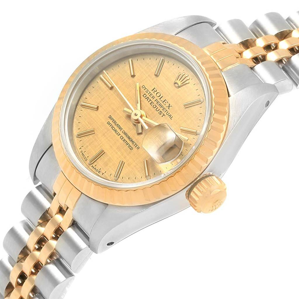 The image shows a close-up, angled view of a Rolex Datejust 69173 Women
s Stainless Steel Champagne Dial 69173 Women
s Stainless Steel Champagne Dial watch highlighting its dial, bezel, bracelet, and crown.