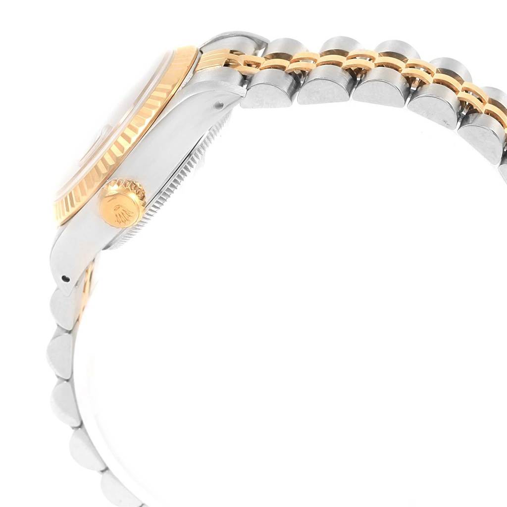 This image shows the side view of a Rolex Datejust 69173 Women
s Stainless Steel Champagne Dial 69173 Women
s Stainless Steel Champagne Dial watch, highlighting the crown, bezel, and part of the bracelet.