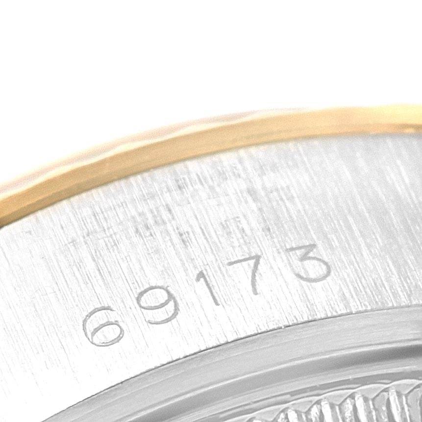 This image shows a close-up of the serial number engraved on the case of a Rolex Datejust 69173 Women's Stainless Steel Champagne Dial 69173 Women's Stainless Steel Champagne Dial model.