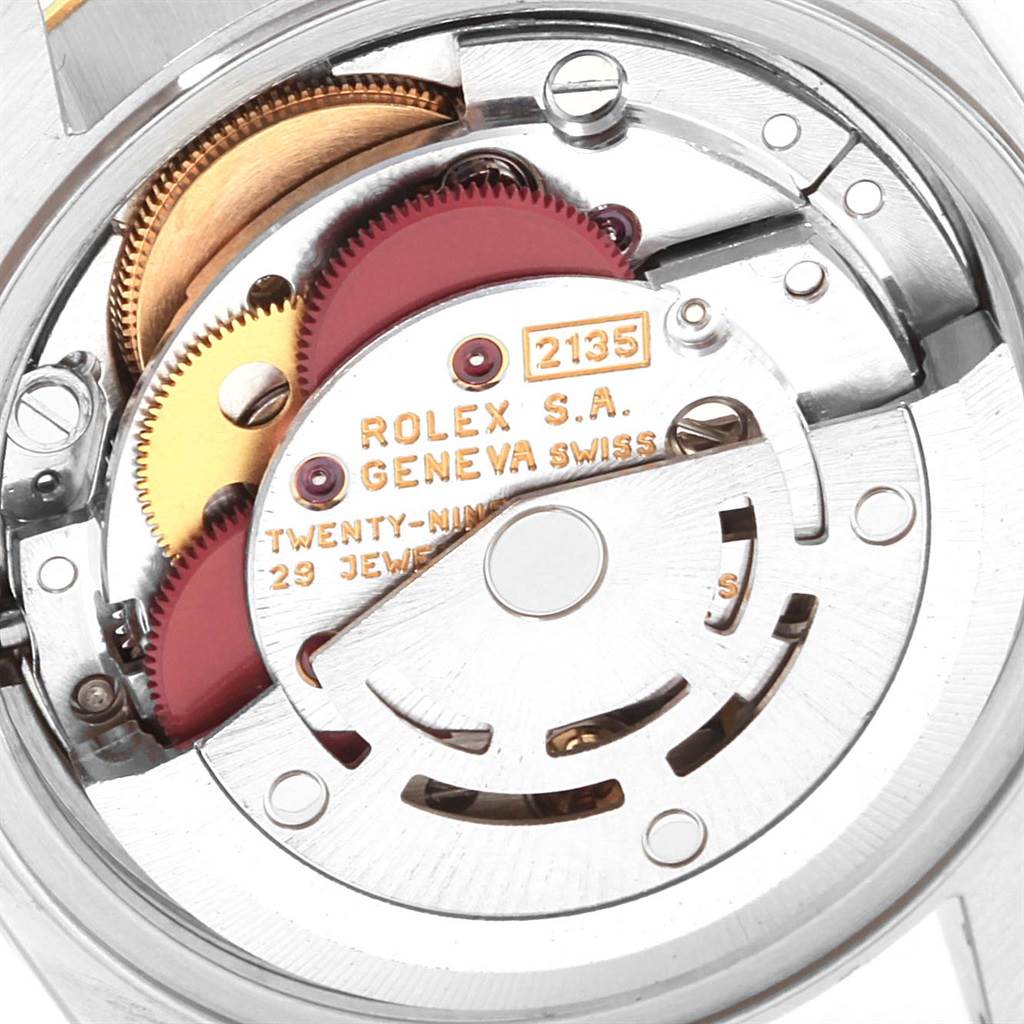 This close-up image shows the internal mechanics of a Rolex Datejust 69173 Women's Stainless Steel Champagne Dial 69173 Women's Stainless Steel Champagne Dial watch, highlighting the movement components. 