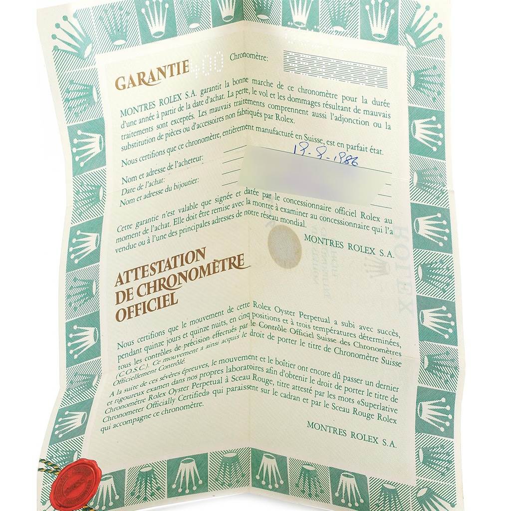 The image shows a folded warranty certificate for a Rolex Datejust 68273 Women's Steel and Gold (two tone) Champagne Dial 68273 Women's Steel and Gold (two tone) Champagne Dial, featuring text and official stamps.