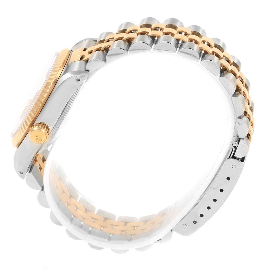 The image shows a side view of a Rolex Datejust 68273 Women's Steel and Gold (two tone) Champagne Dial 68273 Women's Steel and Gold (two tone) Champagne Dial watch, highlighting the two-tone bracelet, crown, and part of the case.