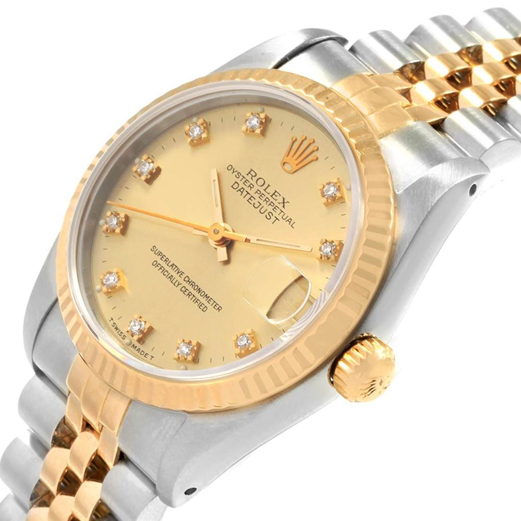 The Rolex Datejust 68273 Women's Steel and Gold (two tone) Champagne Dial 68273 Women's Steel and Gold (two tone) Champagne Dial model watch is shown from an angled perspective featuring its dial, bezel, crown, and part of its bracelet.
