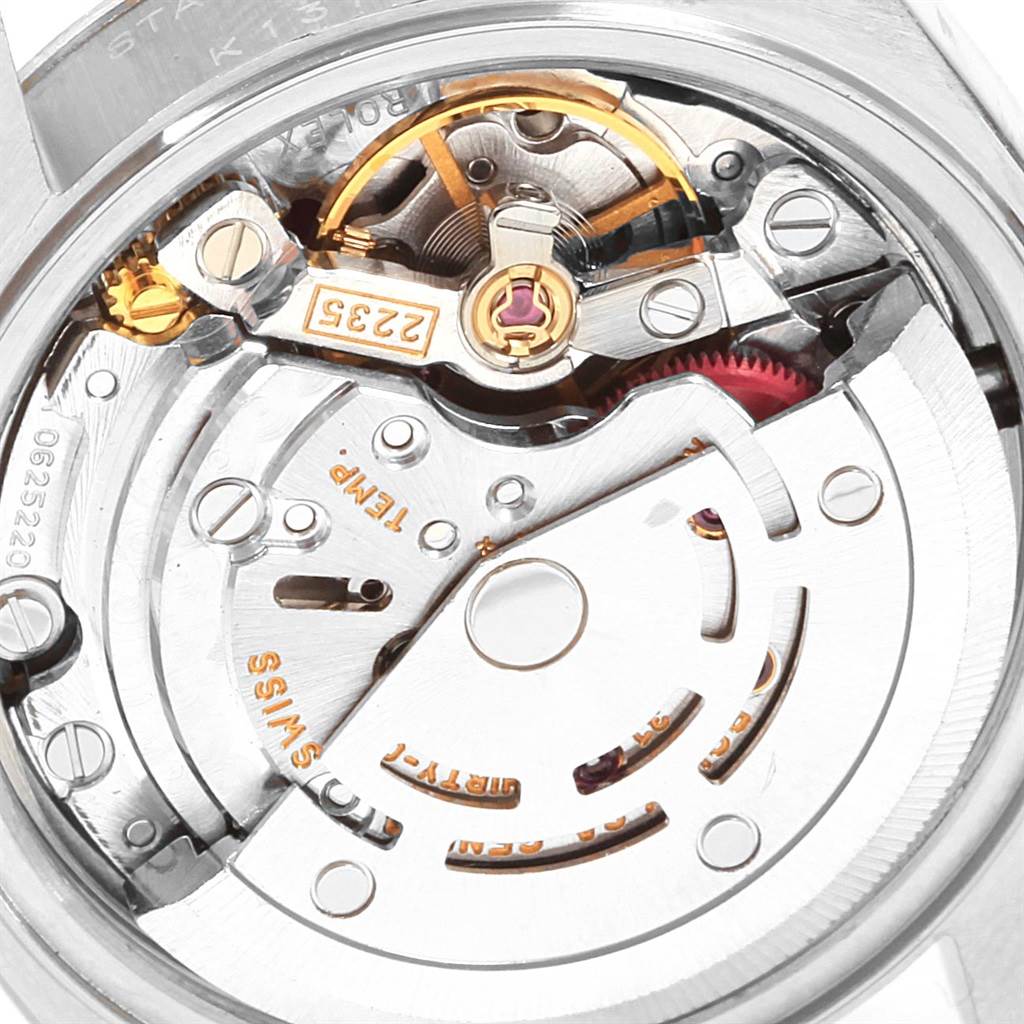 This image shows a close-up of the movement mechanism inside a Rolex Datejust 79174 Women
s Stainless Steel Silver Dial 79174 Women
s Stainless Steel Silver Dial watch.