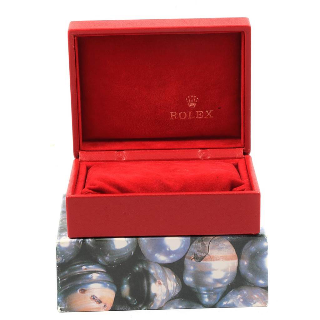 This image shows an open red box with a velvet interior, branded with Rolex, likely packaging for a Datejust model watch.