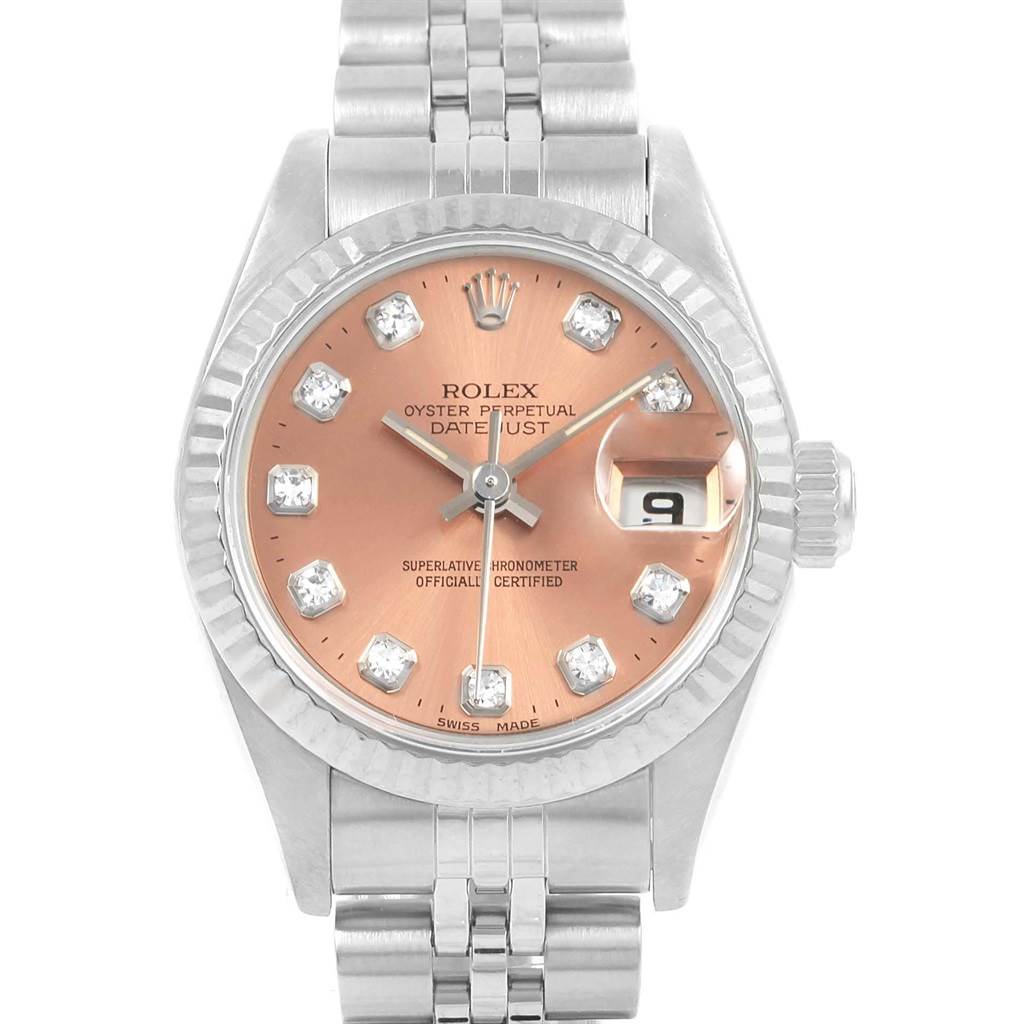 The Rolex Datejust 69174 Women
s Stainless Steel Pink Dial 69174 Women
s Stainless Steel Pink Dial watch is shown from a front angle, displaying its dial, bezel, bracelet, and date window.