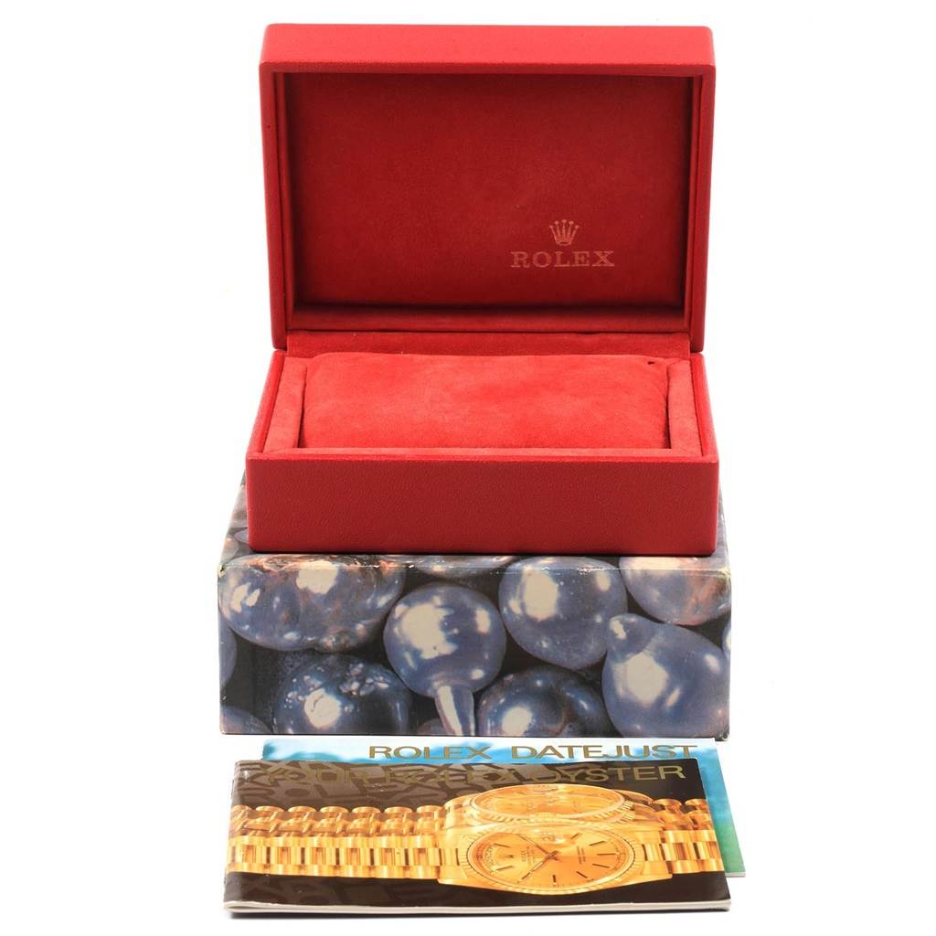 The image shows a Rolex Datejust 69174 Women
s Stainless Steel Pink Dial 69174 Women
s Stainless Steel Pink Dial watch box and a booklet with an illustration of the Datejust model.