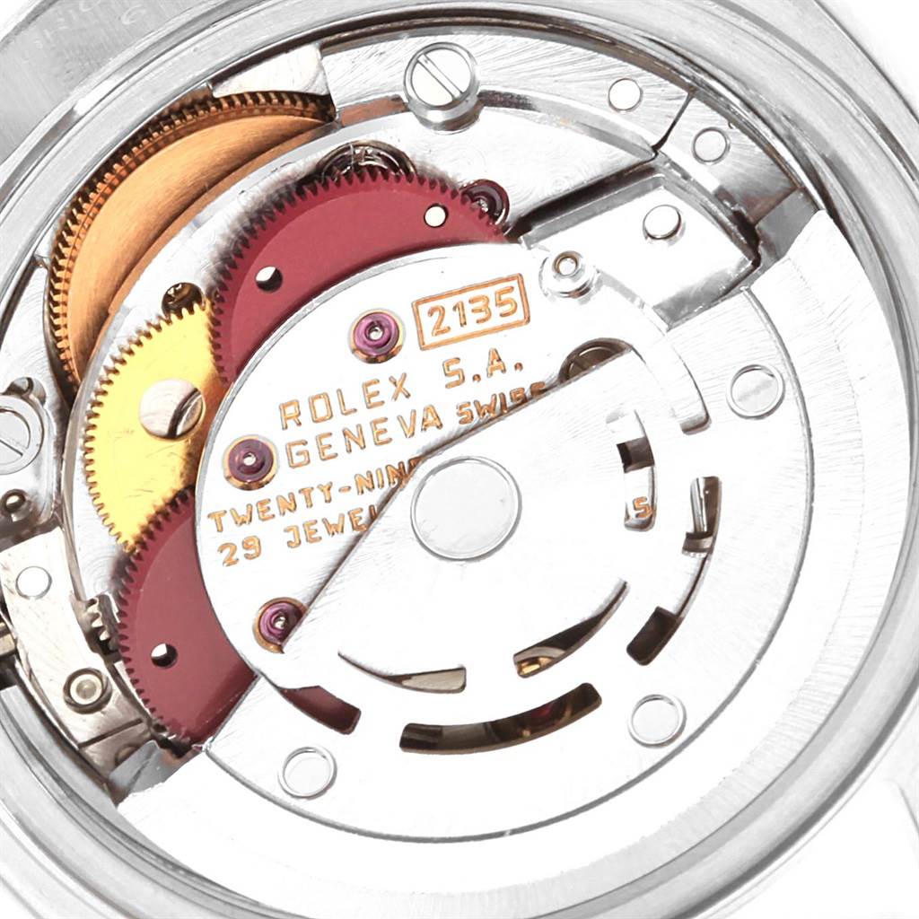 This image shows the internal movement mechanism of a Rolex Datejust 69174 Women
s Stainless Steel Pink Dial 69174 Women
s Stainless Steel Pink Dial, including gears and other components.