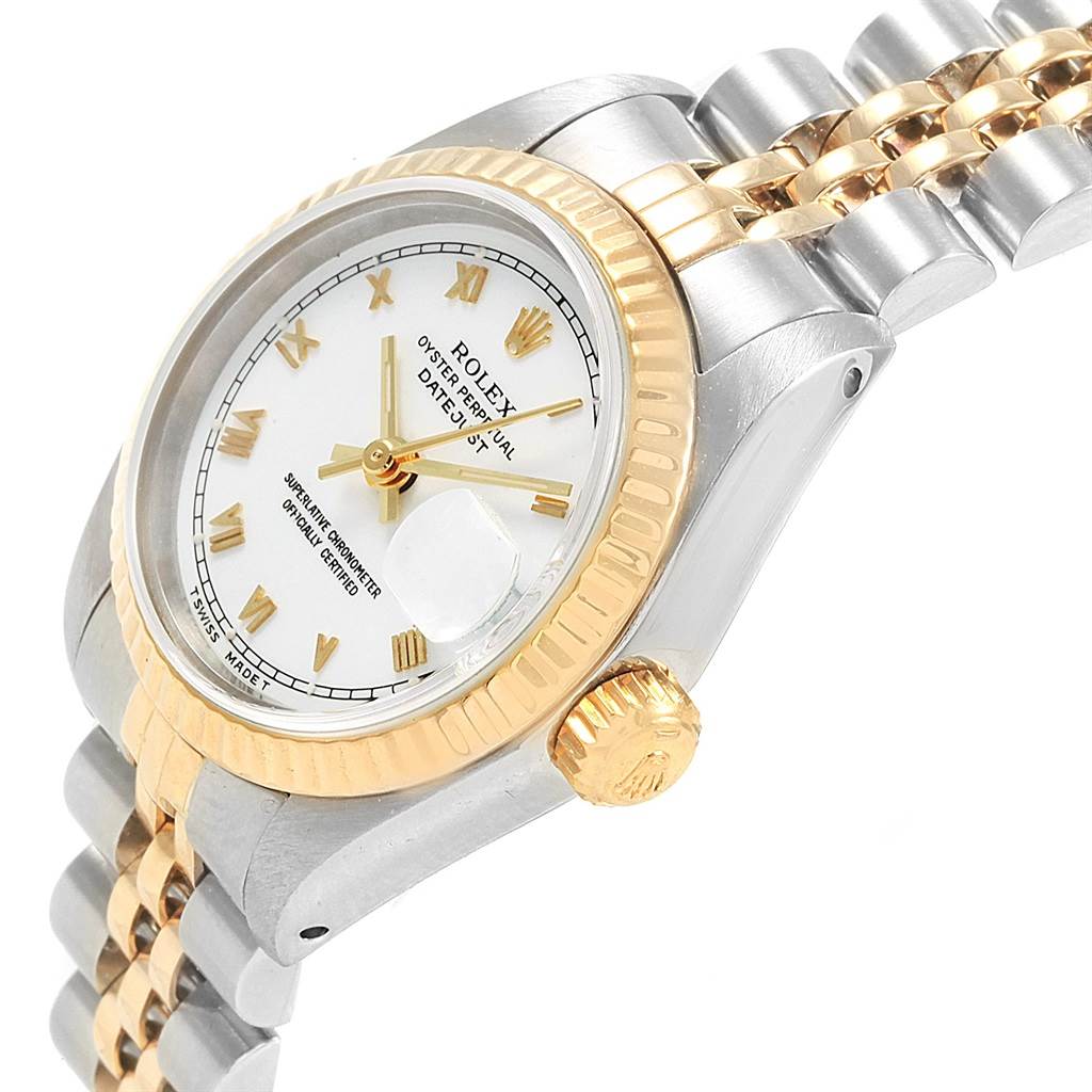 The image shows a side view of a Rolex Datejust 69173 Women's Stainless Steel White Dial 69173 Women's Stainless Steel White Dial watch, highlighting its gold crown, fluted bezel, and two-tone bracelet.