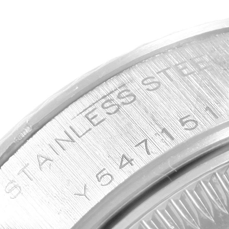 The image shows an angled close-up of the case back of a Rolex Datejust 79174 Women's Stainless Steel Black Dial 79174 Women's Stainless Steel Black Dial, highlighting the engraving and serial number.