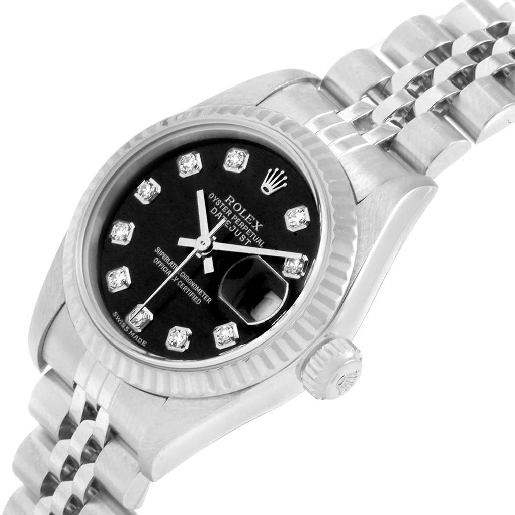 This image shows the face, crown, and part of the bracelet of a Rolex Datejust 79174 Women's Stainless Steel Black Dial 79174 Women's Stainless Steel Black Dial watch from a slight top angle.
