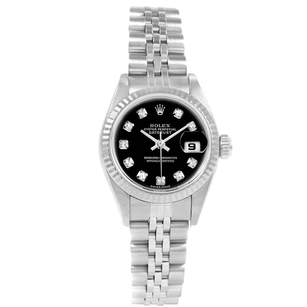 The image shows a front view of a Rolex Datejust 79174 Women's Stainless Steel Black Dial 79174 Women's Stainless Steel Black Dial watch with its black dial, fluted bezel, date window, and Jubilee bracelet.