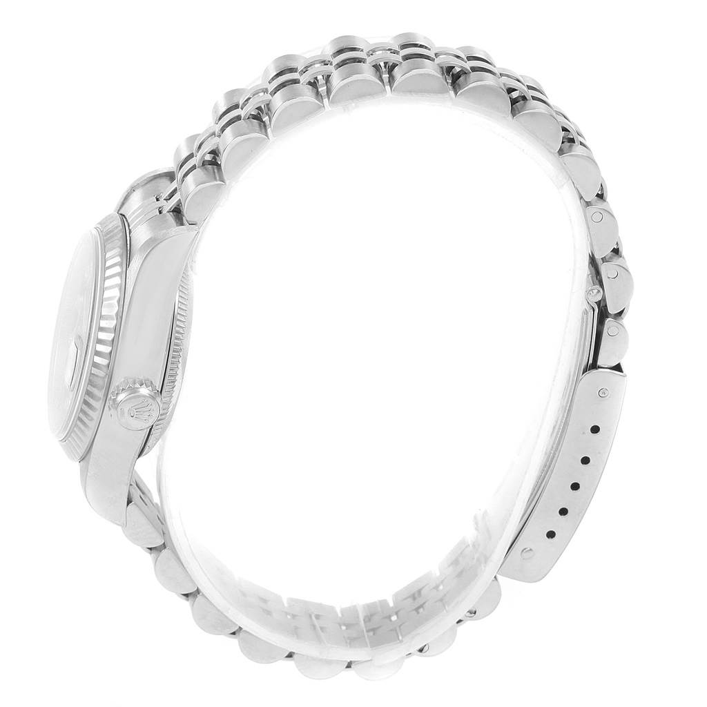 This image shows a side view of the Rolex Datejust 79174 Women's Stainless Steel Black Dial 79174 Women's Stainless Steel Black Dial watch, highlighting its case, crown, and jubilee bracelet.