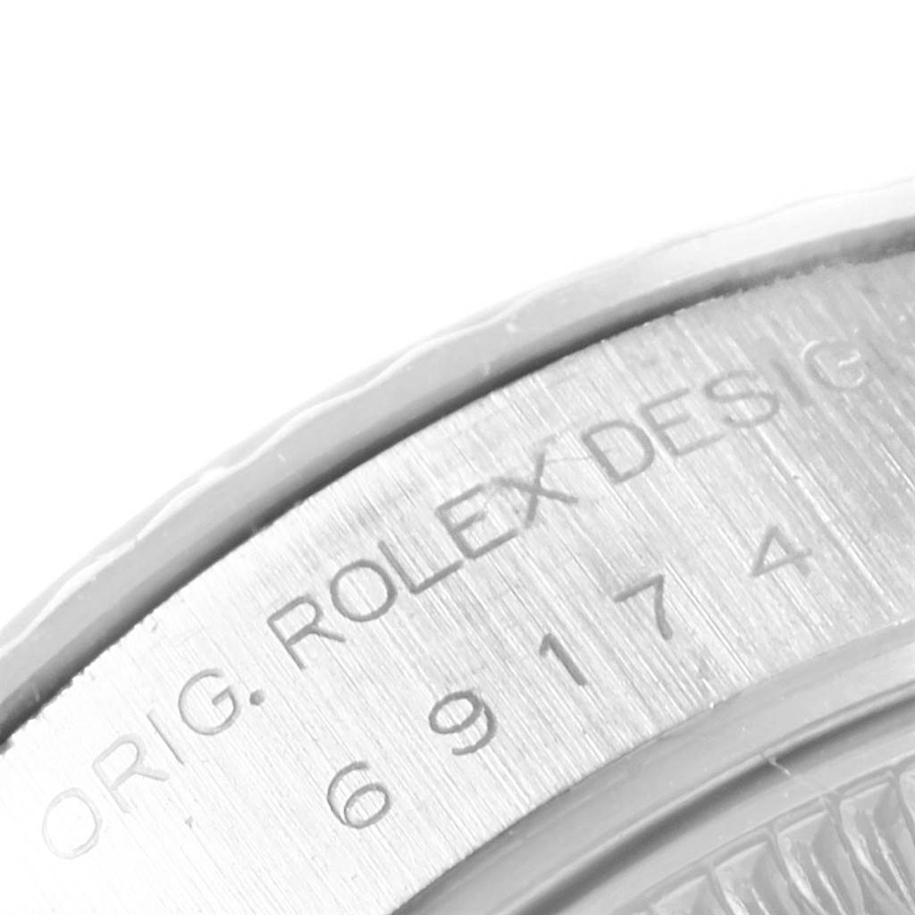 This is a close-up view of the Rolex Datejust 69174 Women
s Stainless Steel Silver Dial 69174 Women
s Stainless Steel Silver Dial model
s case back, showing the engraved "ROLEX DESIGN" and model number.