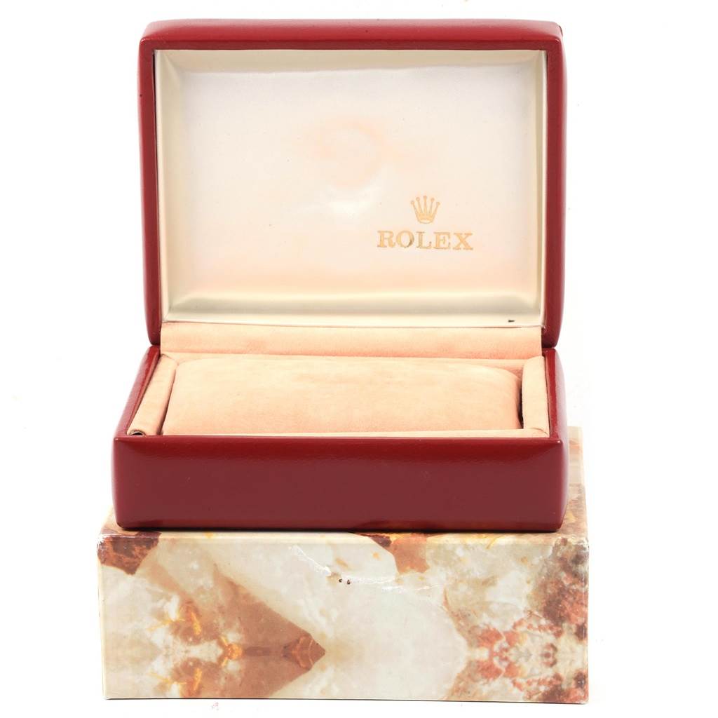 The image shows an open Rolex box for the Datejust model, displaying its interior from a front angle.