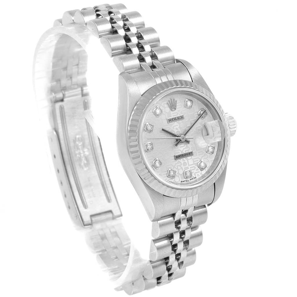 The Rolex Datejust 69174 Women
s Stainless Steel Silver Dial 69174 Women
s Stainless Steel Silver Dial watch is shown at an angled side view, displaying its face, bezel, bracelet, and clasp.
