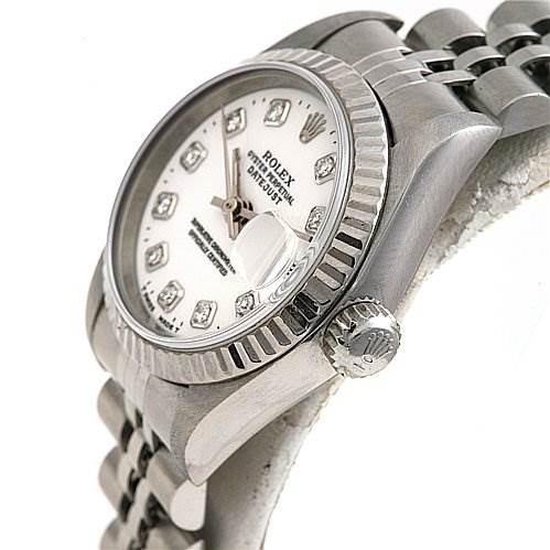 This image shows a Rolex Datejust 69174 Women's Stainless Steel White Dial 69174 Women's Stainless Steel White Dial watch at a side angle, highlighting the bezel, crown, and a partial view of the bracelet.