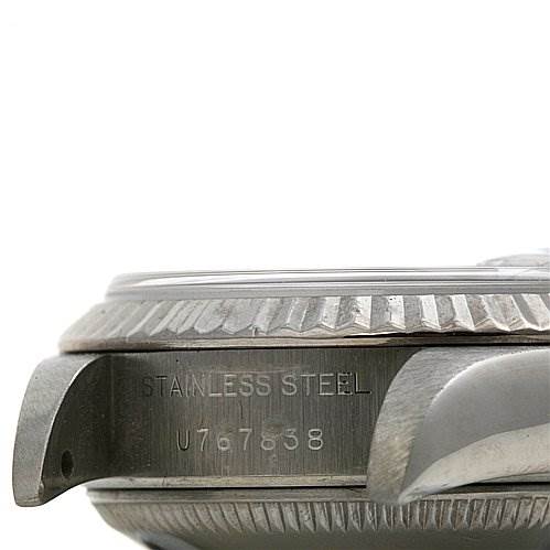 This image shows a side angle of the case and lugs of a Rolex Datejust 69174 Women's Stainless Steel White Dial 69174 Women's Stainless Steel White Dial watch, highlighting the "Stainless Steel" engraving.