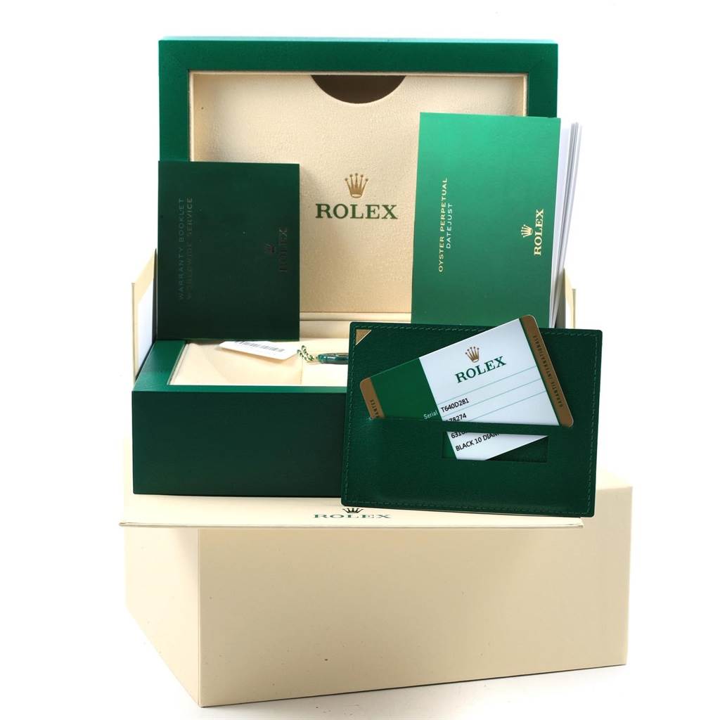 The image shows the packaging and accessories for a Rolex Datejust 178274 Women's Stainless Steel Black Dial 178274 Women's Stainless Steel Black Dial watch, including the box, warranty card, booklet, and tags.