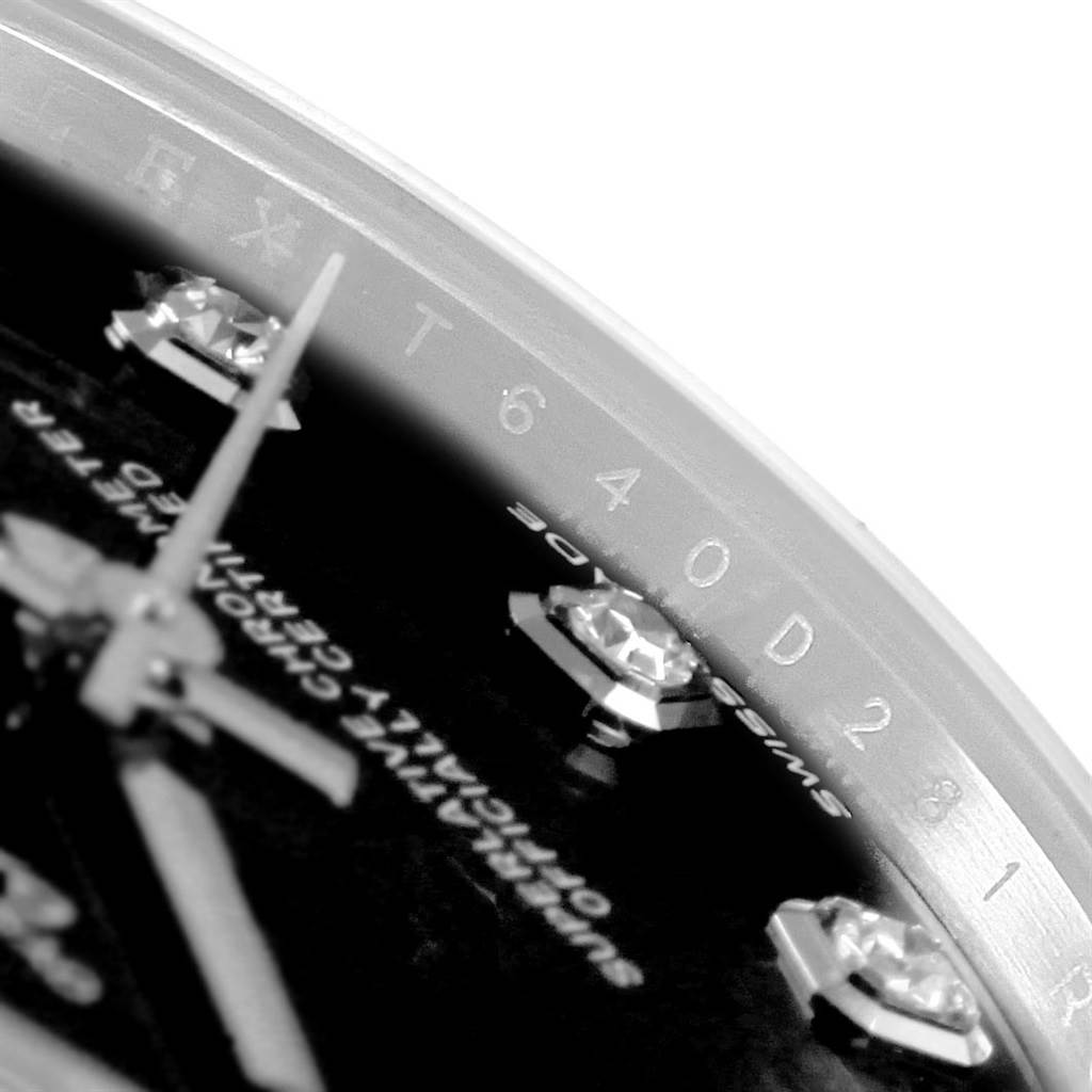 The image shows a close-up of the dial and part of the rehaut of a Rolex Datejust 178274 Women's Stainless Steel Black Dial 178274 Women's Stainless Steel Black Dial watch, highlighting the diamond hour markers and engraved serial number.