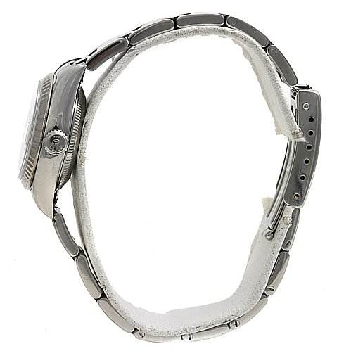 The image shows a side view of a Rolex Datejust 79174 Women's Stainless Steel Silver Dial 79174 Women's Stainless Steel Silver Dial watch, highlighting the case, bezel, crown, and metal bracelet.