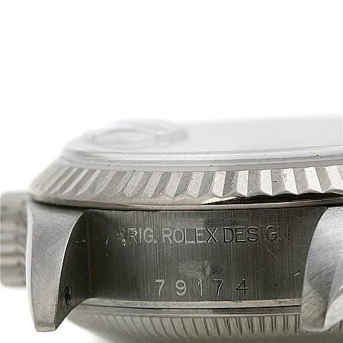 The image shows a close-up side view of the case and bezel of a Rolex Datejust 79174 Women's Stainless Steel Silver Dial 79174 Women's Stainless Steel Silver Dial watch, highlighting the model number and design engraving.