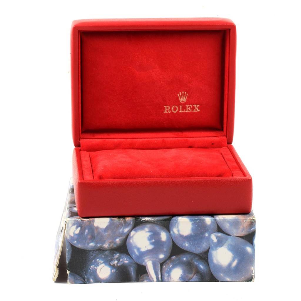 The image shows an open red Rolex watch box for a Datejust model, viewed from the front.