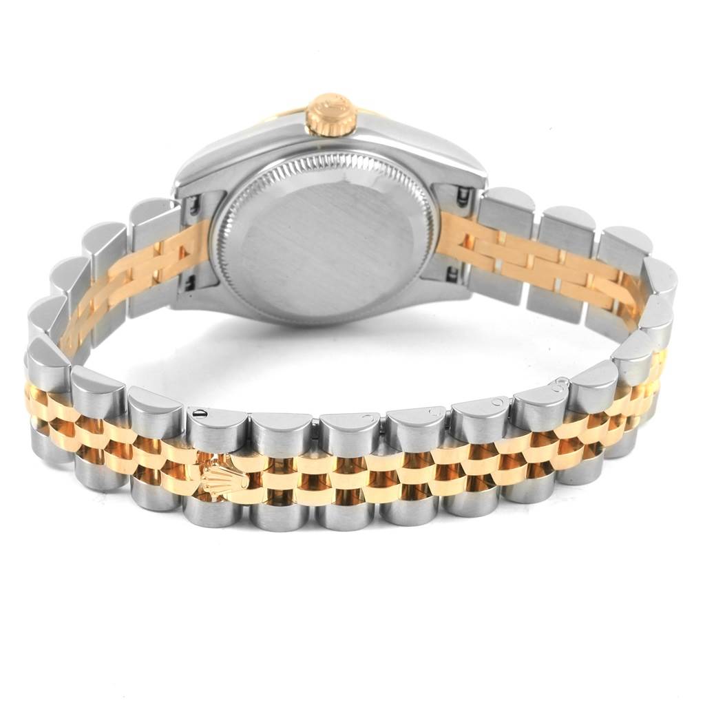 The image shows the back and bracelet of a Rolex Datejust 179173 Women's Steel and Gold (two tone) Silver Dial 179173 Women's Steel and Gold (two tone) Silver Dial watch, featuring a two-tone metal bracelet and a screw-down case back.