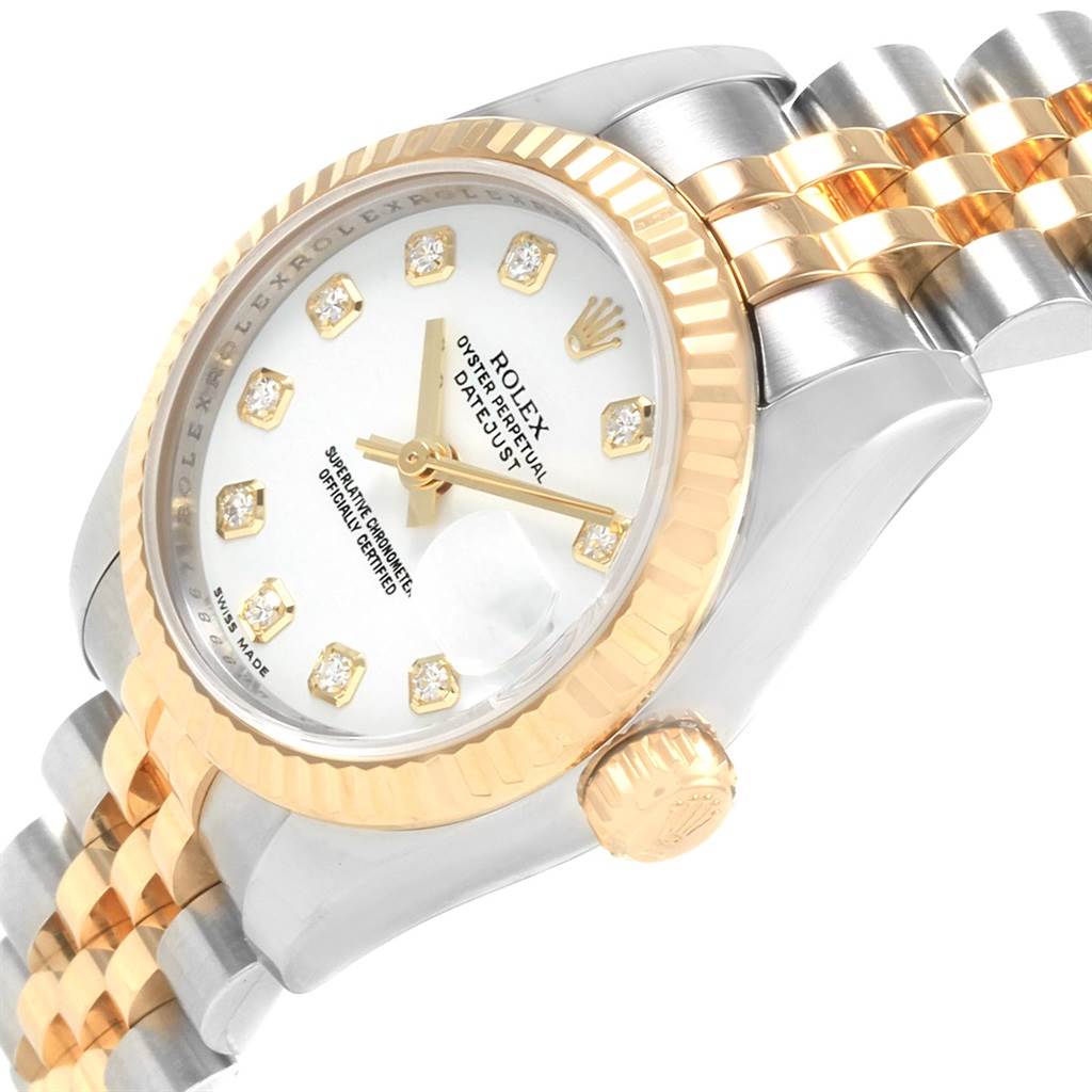 This image shows a close-up angle of the Rolex Datejust 179173 Women's Steel and Gold (two tone) Silver Dial 179173 Women's Steel and Gold (two tone) Silver Dial watch, highlighting the bezel, dial, crown, and part of the bracelet.