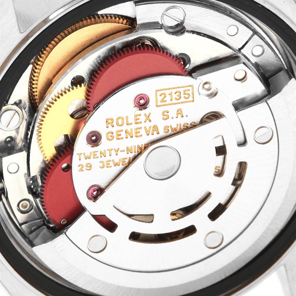 This is a close-up view of the movement mechanism inside a Rolex Datejust 69173 Women's Stainless Steel Champagne Dial 69173 Women's Stainless Steel Champagne Dial watch, highlighting the gears and rotors.