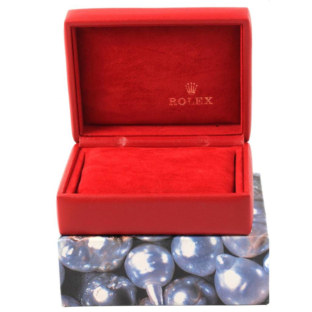 This is an open red Rolex Datejust 69173 Women's Stainless Steel Champagne Dial 69173 Women's Stainless Steel Champagne Dial watch box, with the Rolex logo visible inside.