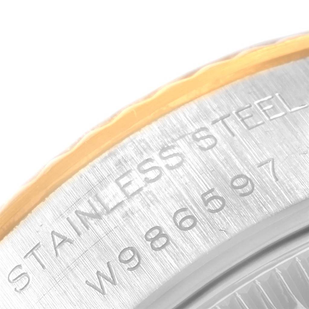 This close-up image displays the stainless steel casing with the serial number of a Rolex Datejust 69173 Women's Stainless Steel Champagne Dial 69173 Women's Stainless Steel Champagne Dial watch.