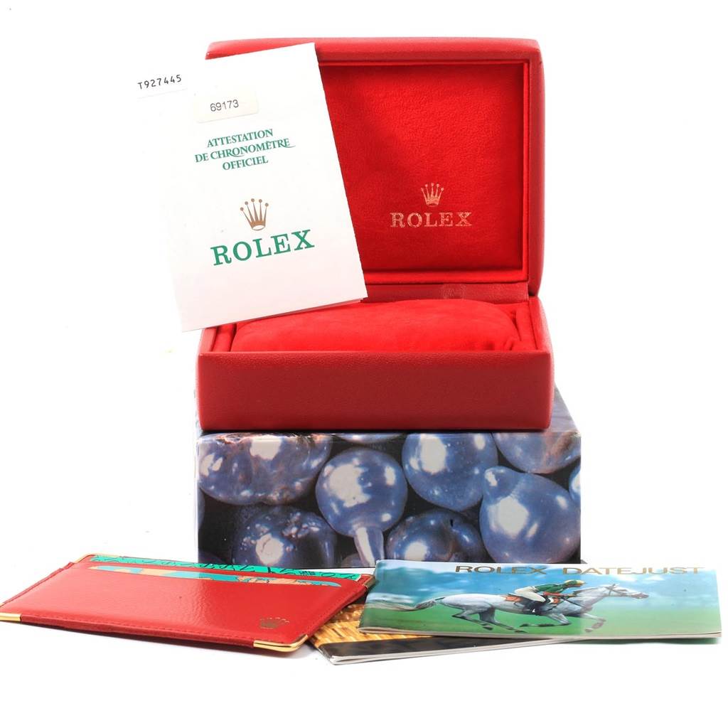The image shows a Rolex Datejust 69173 Women's Stainless Steel Blue Dial 69173 Women's Stainless Steel Blue Dial watch box with official documents and booklets displayed around it.