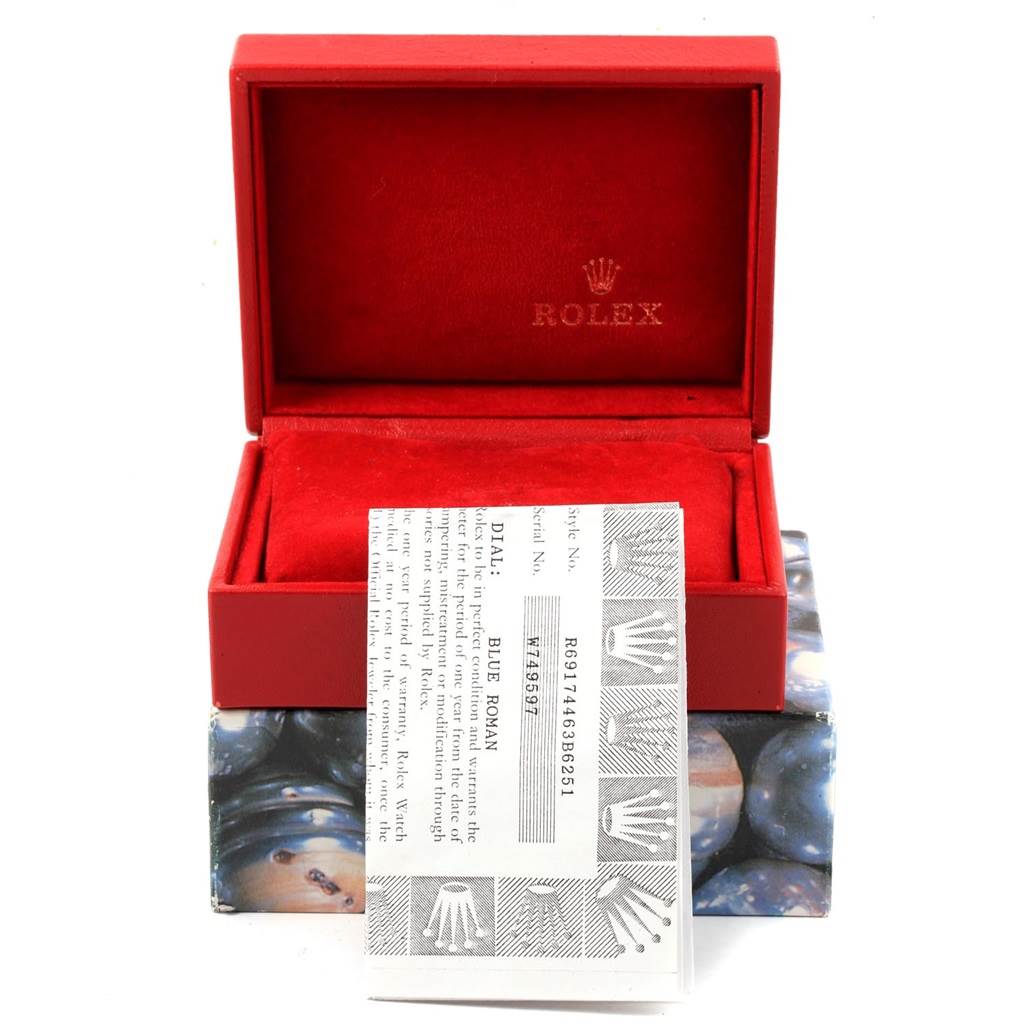 The image shows a red Rolex box and paperwork for the Datejust model.