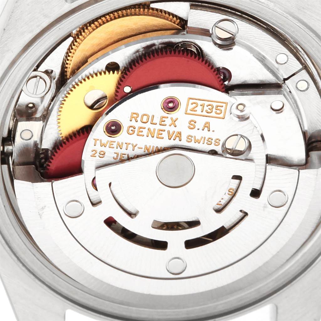 The image shows a close-up view of the movement and internal mechanisms of the Rolex Datejust 69174 Women's Stainless Steel Blue Dial 69174 Women's Stainless Steel Blue Dial watch.